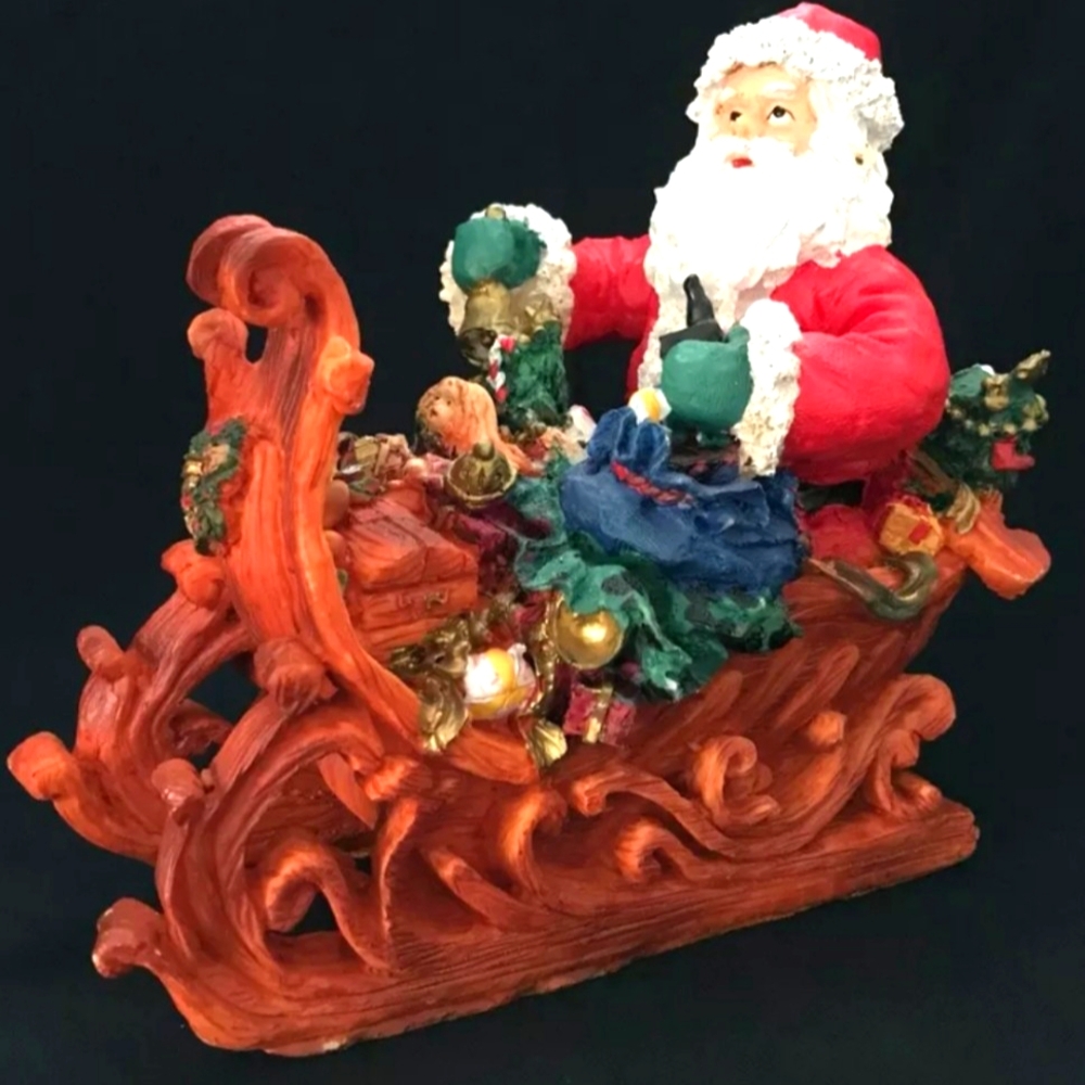 Holiday Collections Polyresin Santa in Sled NIB